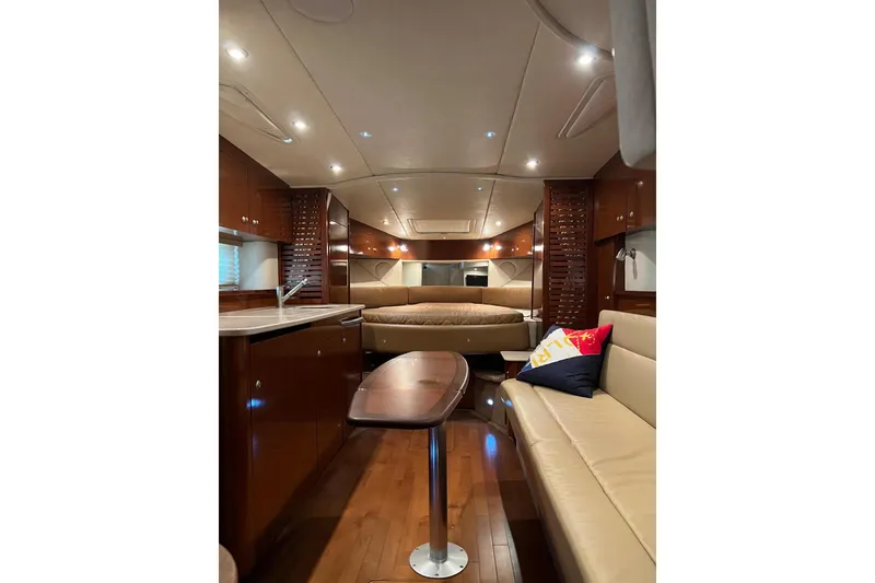 Slide: The Image of Luxurious interior of 2009 Sea Ray Sundancer 350 yacht with elegant wood finishes and cozy seating. - 40
