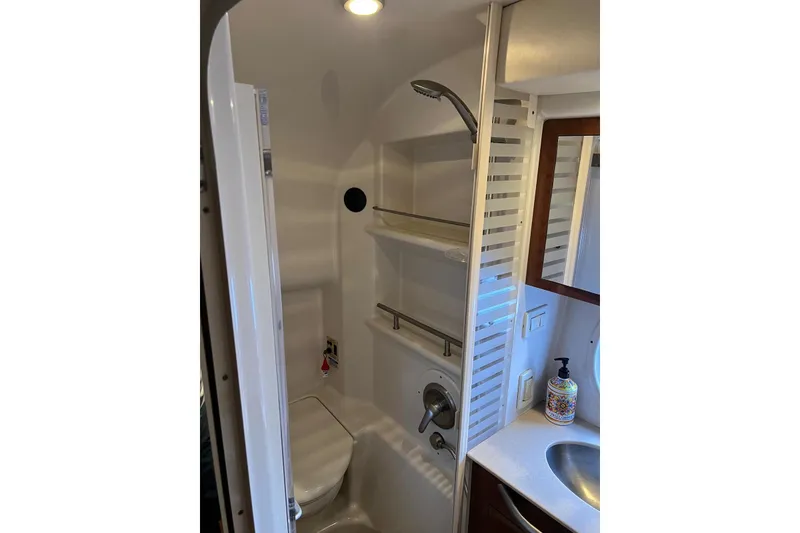 Slide: The Image of 2009 Sea Ray Sundancer 350 bathroom with shower, sink, and modern fixtures. - 44