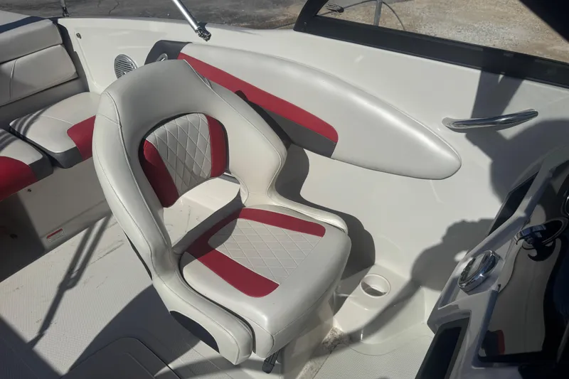 Slide: The Image of Interior of a 2016 Tahoe 500 TF boat with red and white seating. - 10