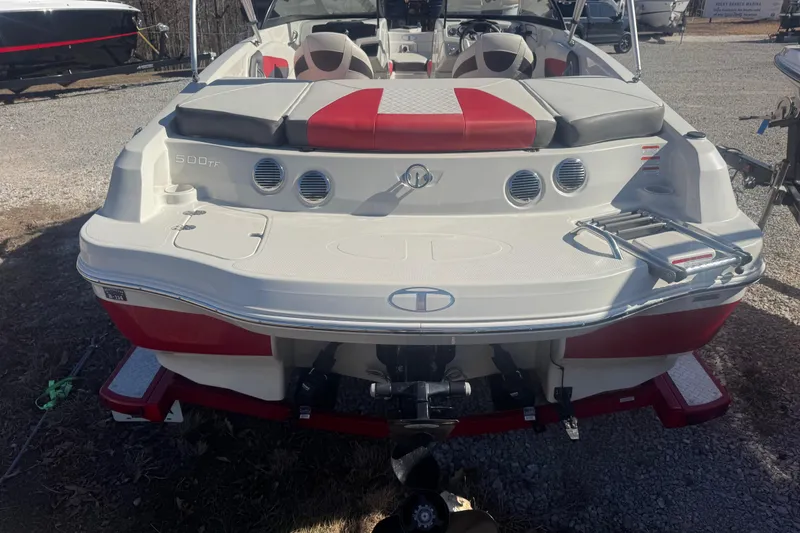 Slide: The Image of 2016 Tahoe 500 TF boat with red and white seating, rear view. - 3