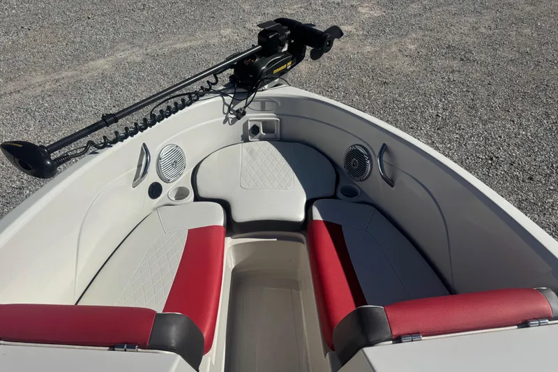 Slide: The Image of Interior of a 2016 Tahoe 500 TF boat with red and white seating. - 6