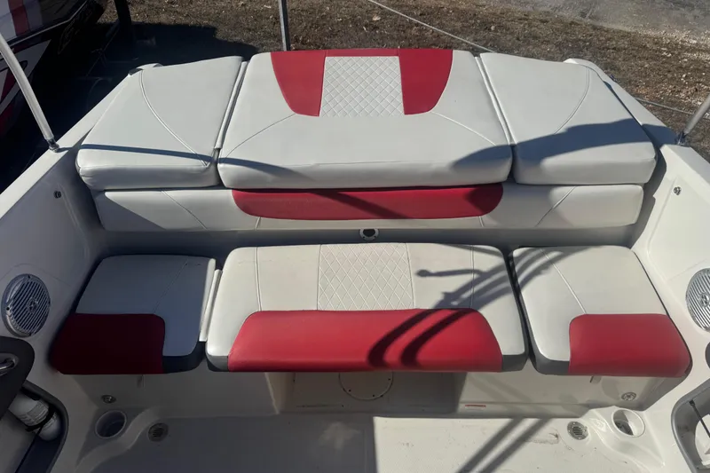 Slide: The Image of 2016 Tahoe 500 TF boat interior with red and white cushioned seating. - 8