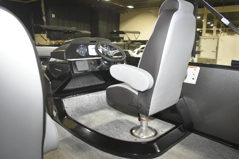 Slide: The Image of 2026 Premier 230 Sunsation RL-PTX CL boat interior with steering console and captain's chair. - 11