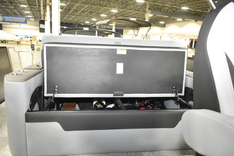 Slide: The Image of Open storage compartment in 2026 Premier 230 Sunsation RL - PTX CL boat interior. - 16