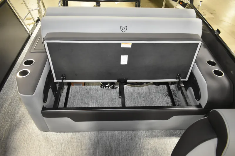 Slide: The Image of 2026 Premier 230 SUNSATION RL - PTX CL boat interior with open storage compartment. - 17