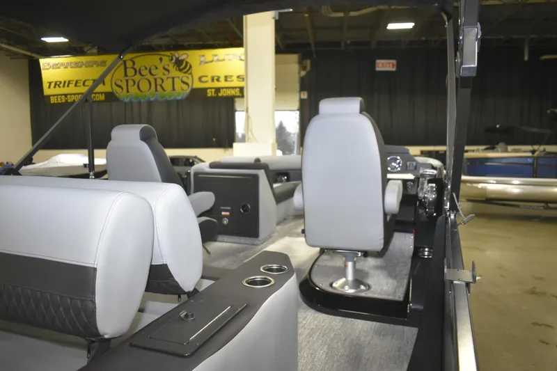 Slide: The Image of Interior of 2026 Premier 230 Sunsation RL - PTX CL pontoon boat with seating and controls. - 6