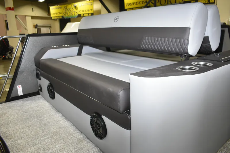 Slide: The Image of 2026 Premier 230 Sunsation RL - PTX CL boat interior with cushioned seating and cup holders. - 7