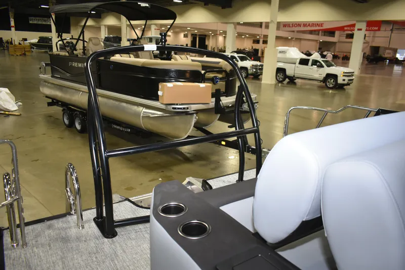 Slide: The Image of 2026 Premier 230 Sunsation RL - PTX CL pontoon boat displayed indoors. - 8