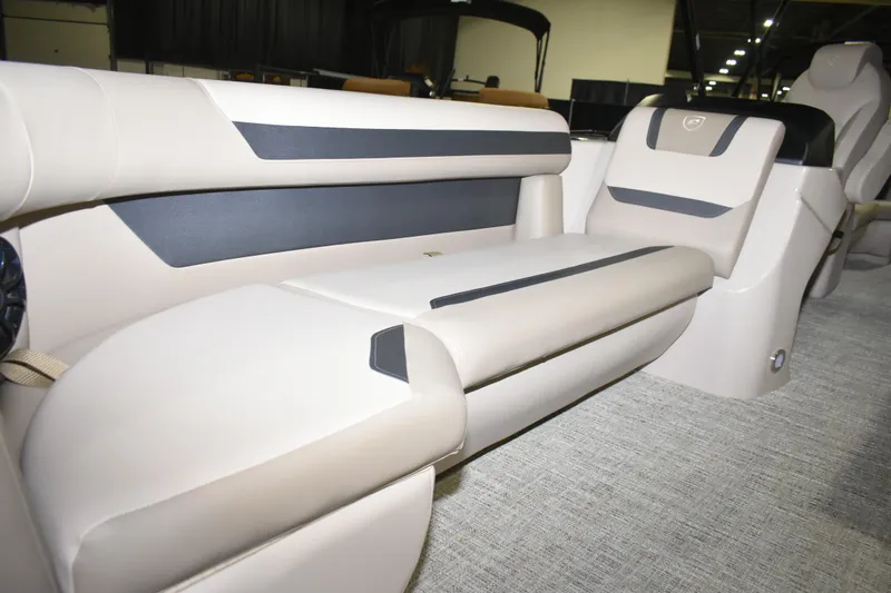 Slide: The Image of 2026 Premier 220 Sunscape RF - CL boat interior with beige and black seating. - 11
