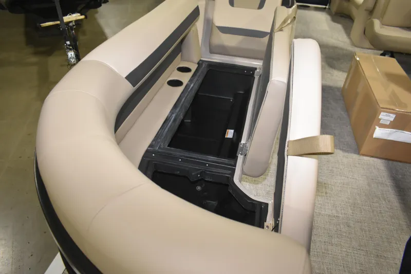 Slide: The Image of 2026 Premier 220 Sunscape RF - CL boat interior with open storage compartment. - 13