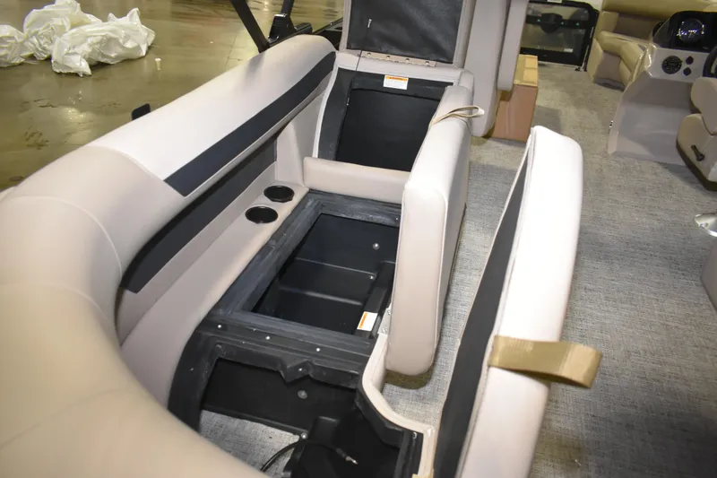 Slide: The Image of 2026 Premier 220 Sunscape RF - CL boat interior with open storage compartments and seating. - 16