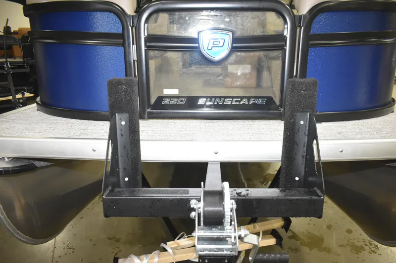 Slide: The Image of 2026 Premier 220 Sunscape RF - CL pontoon boat rear view with logo and trailer. - 17