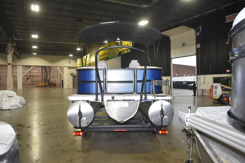 Slide: The Image of 2026 Premier 220 Sunscape RF - CL pontoon boat displayed indoors. - 4