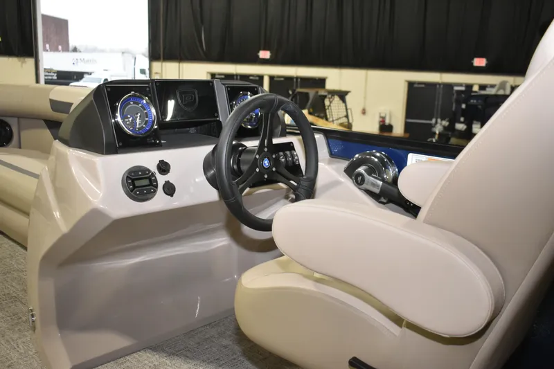 Slide: The Image of 2026 Premier 220 Sunscape RF - CL boat interior with steering wheel and dashboard controls. - 7