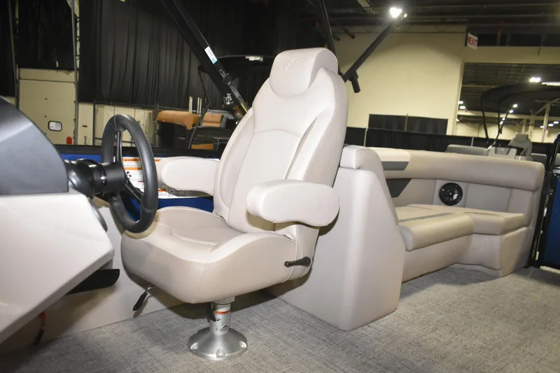 Slide: The Image of 2026 Premier 220 Sunscape RF - CL boat interior with captain's chair and steering wheel. - 8