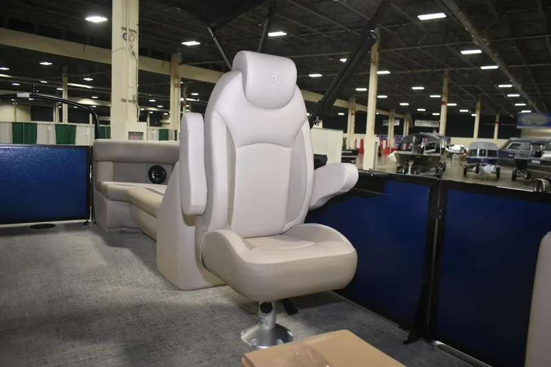 Slide: The Image of Luxury seating on 2026 Premier 220 Sunscape RF - CL boat, indoor showroom display. - 9