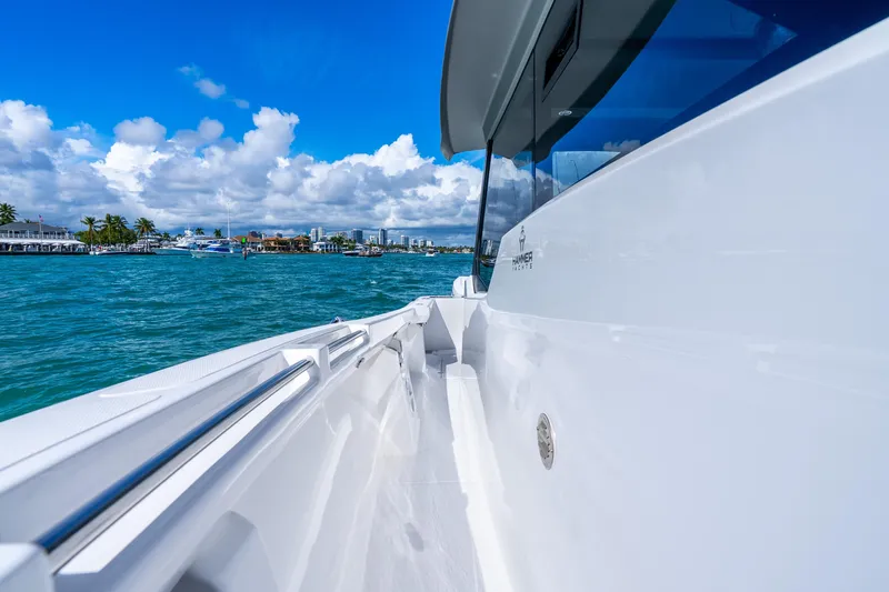 Slide: The Image of 2026 Hammer Yachts 35HH cruising on clear blue waters under a vibrant sky. - 13