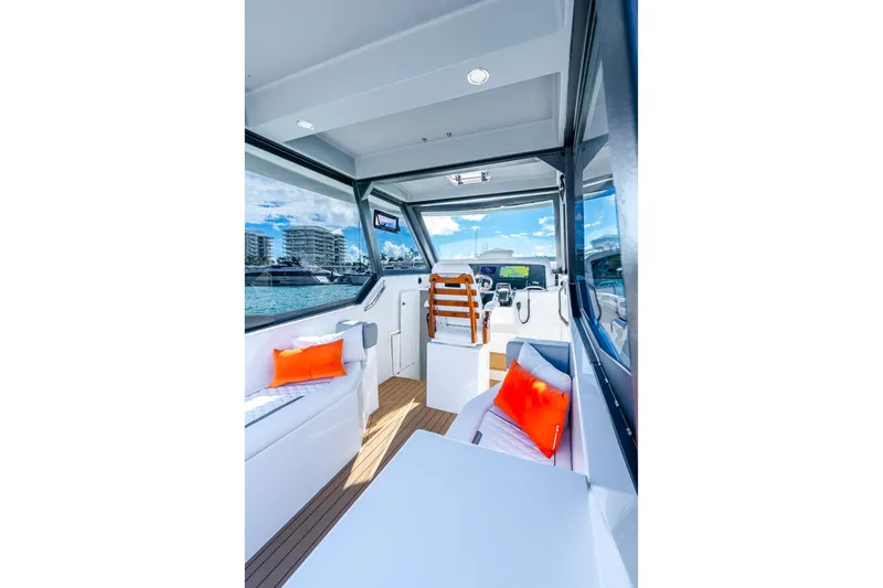 Slide: The Image of Interior of 2026 Hammer Yachts 35HH, featuring modern design and vibrant cushions. - 18