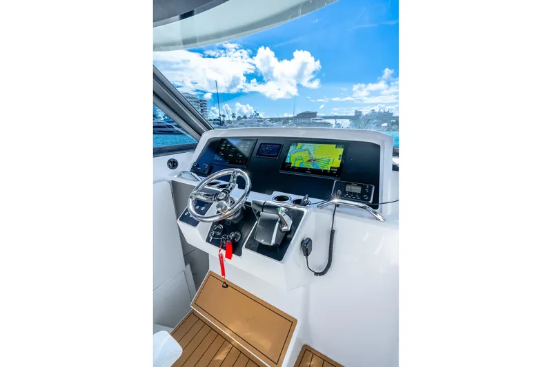 Slide: The Image of Helm of 2026 Hammer Yachts 35HH with modern navigation equipment and steering wheel. - 21