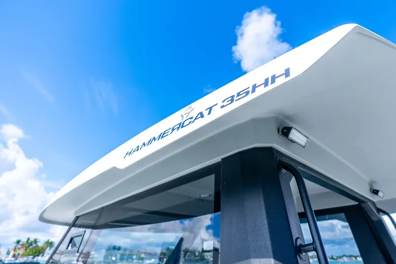 Slide: The Image of 2026 Hammer Yachts 35HH catamaran against a clear blue sky. - 27