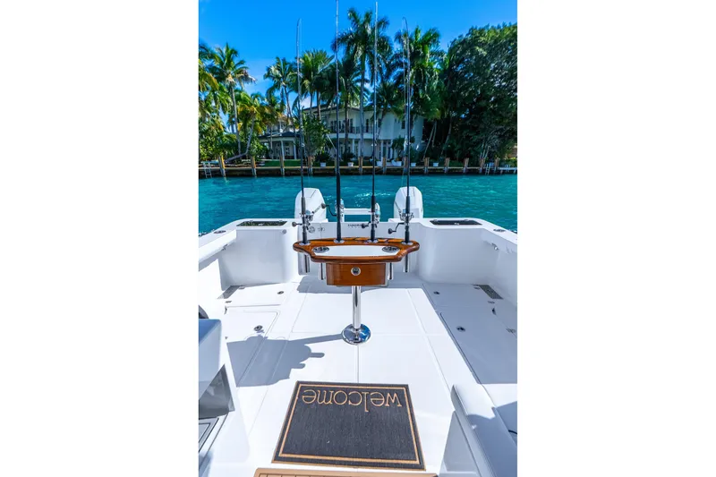 Slide: The Image of 2026 Hammer Yachts 35HH boat deck with fishing rods and welcome mat. - 31