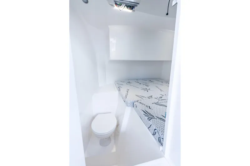 Slide: The Image of Interior of 2026 Hammer Yachts 35HH, featuring compact cabin with bed and toilet. - 39