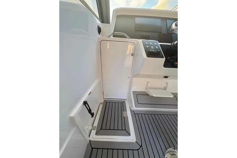 Slide: The Image of Interior view of 2026 Hammer Yachts 35HH cockpit with modern controls and sleek design. - 40