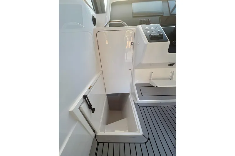 Slide: The Image of 2026 Hammer Yachts 35HH interior with storage compartment and control panel. - 41