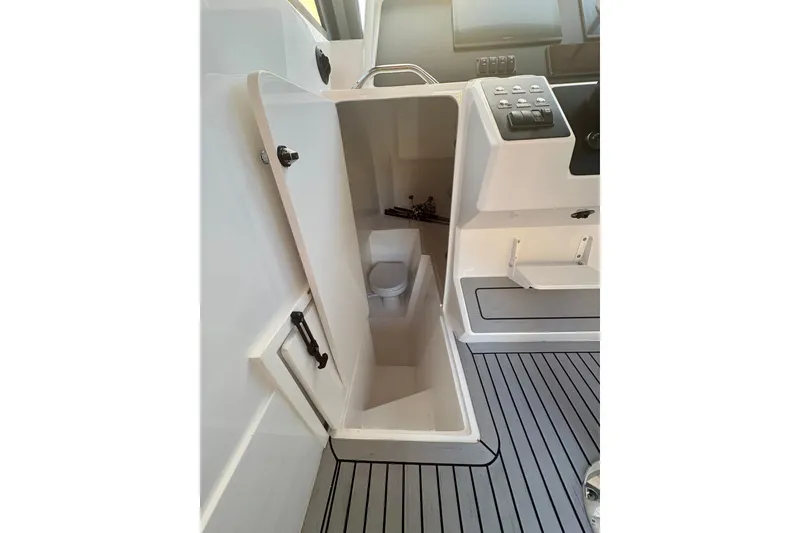 Slide: The Image of Interior of 2026 Hammer Yachts 35HH, featuring compact marine toilet and control panel. - 42