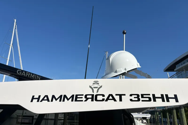 Slide: The Image of 2026 Hammer Yachts 35HH with hard hat, clear blue sky background. - 46
