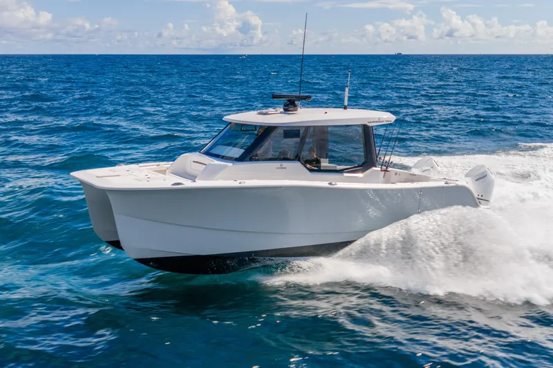 Slide: The Image of 2026 Hammer Yachts 35HH catamaran cruising on open sea under clear skies. - 5