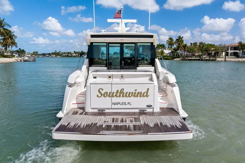 Slide: The Image of 2018 Tiara Yachts C44 Coupe "Southwind" in Naples, FL, cruising on a sunny day. - 11