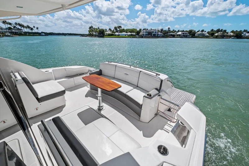 Slide: The Image of 2018 Tiara Yachts C44 Coupe with elegant seating and scenic water view. - 31