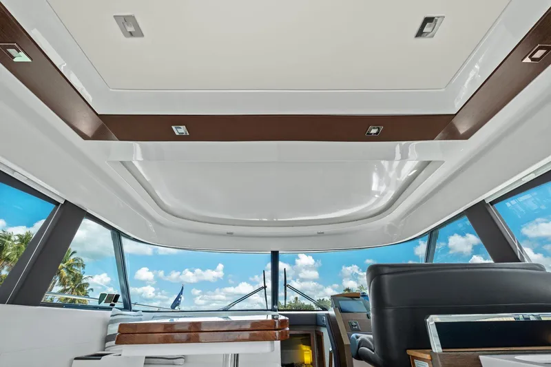 Slide: The Image of Interior view of 2018 Tiara Yachts C44 Coupe, featuring sleek design and panoramic windows. - 41