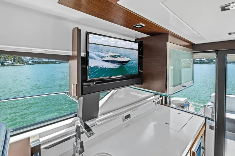 Slide: The Image of Interior of 2018 Tiara Yachts C44 Coupe with TV and scenic water view. - 45