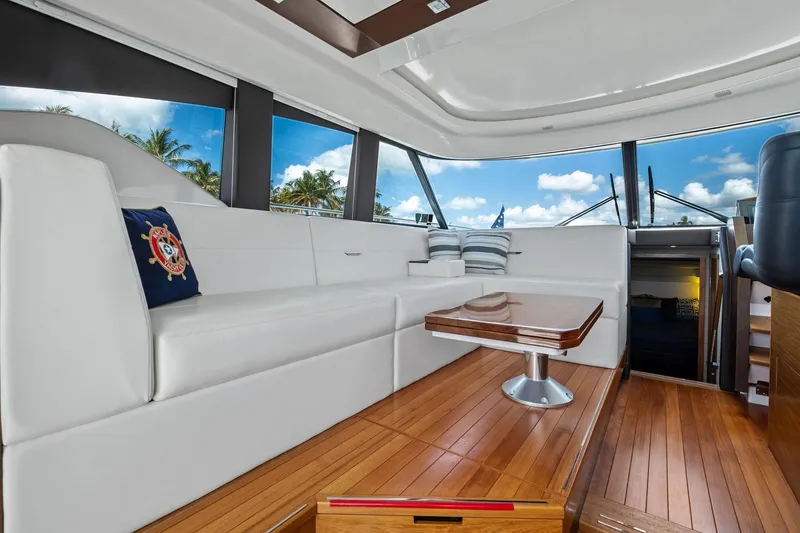 Slide: The Image of Luxurious interior of 2018 Tiara Yachts C44 Coupe with elegant seating and wooden flooring. - 48
