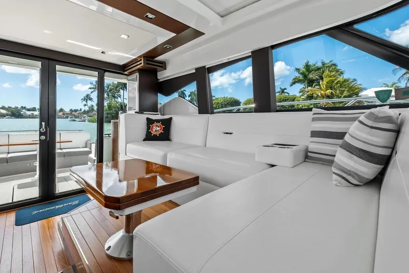 Slide: The Image of Luxurious interior of 2018 Tiara Yachts C44 Coupe with elegant seating and scenic views. - 54
