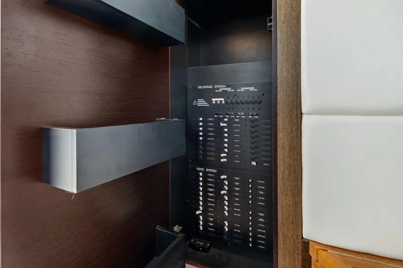 Slide: The Image of Electrical panel inside 2018 Tiara Yachts C44 Coupe, showcasing control systems. - 56