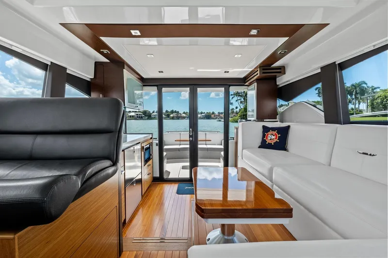 Slide: The Image of Interior of 2018 Tiara Yachts C44 Coupe with luxurious seating and scenic view. - 58