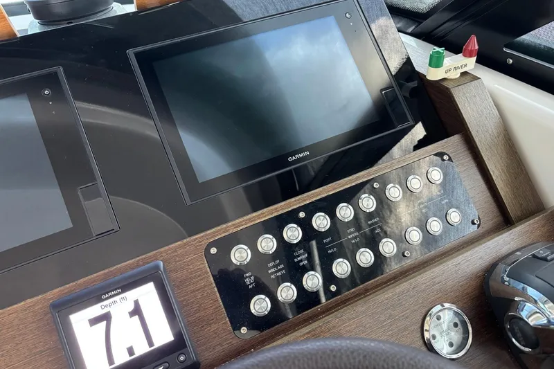Slide: The Image of Control panel of 2018 Tiara Yachts C44 Coupe with Garmin displays and depth gauge. - 6