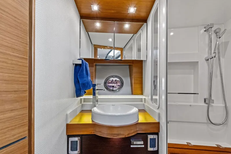 Slide: The Image of Luxurious bathroom in 2018 Tiara Yachts C44 Coupe with modern fixtures and elegant design. - 65