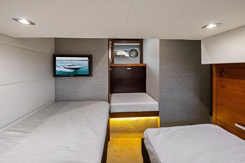 Slide: The Image of 2018 Tiara Yachts C44 Coupe interior cabin with modern design and cozy bedding. - 70