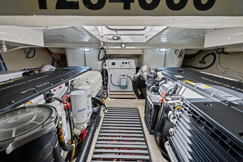Slide: The Image of Engine room of 2018 Tiara Yachts C44 Coupe, featuring dual Volvo Penta IPS 600 engines. - 71