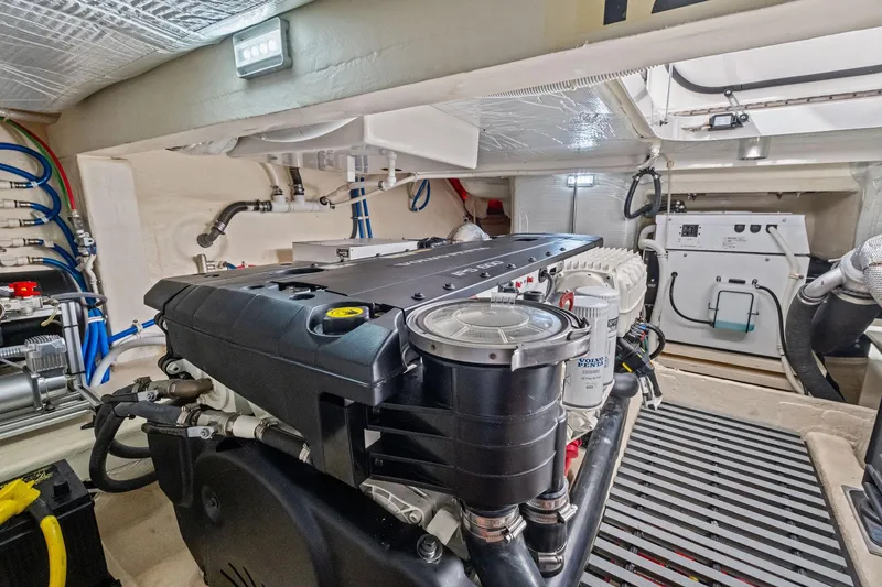 Slide: The Image of Engine room of 2018 Tiara Yachts C44 Coupe, showcasing mechanical components and systems. - 72