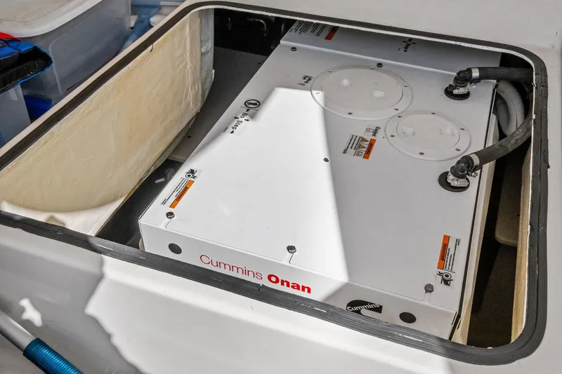 Slide: The Image of Cummins Onan generator in 2018 Tiara Yachts C44 Coupe engine compartment. - 74