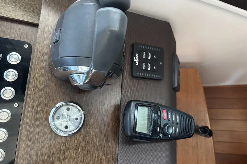 Slide: The Image of Control panel of a 2018 Tiara Yachts C44 Coupe with throttle and communication device. - 8