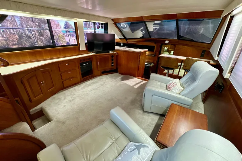 Slide: The Image of Luxurious interior of 1988 Californian 45 Motor Yacht with plush seating and elegant wood finishes. - 12