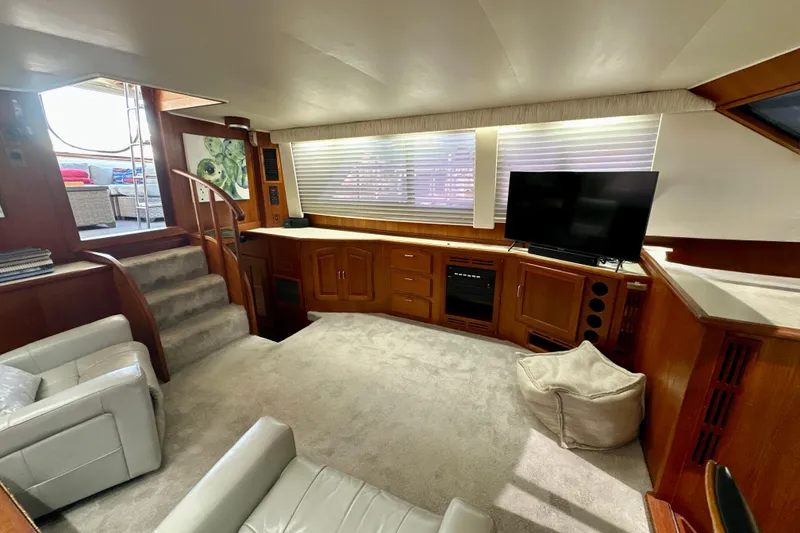 Slide: The Image of Interior of 1988 Californian 45 Motor Yacht with modern furnishings and entertainment setup. - 13