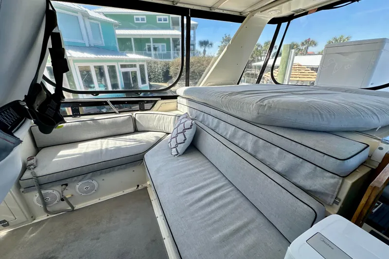 Slide: The Image of 1988 Californian 45 Motor Yacht interior with gray seating and large windows. - 30