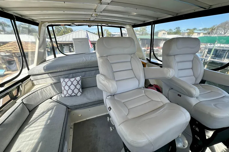 Slide: The Image of 1988 Californian 45 Motor Yacht interior with plush seating and panoramic windows. - 31